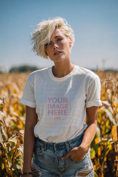 T-Shirt Mockup with Woman Posing in Corn Field for Halloween Scene