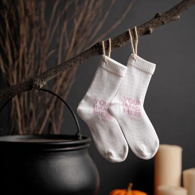 Socks Mockup with Orange Pot and Broomstick for Halloween Display