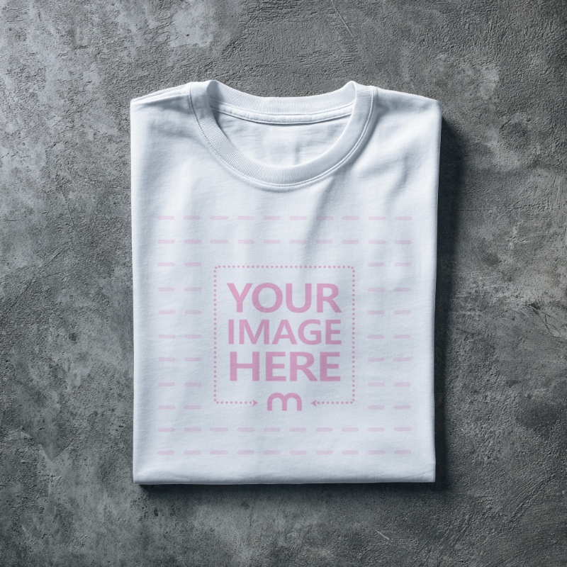 Folded Shirt Mockup Top View on Concrete Floor preview image