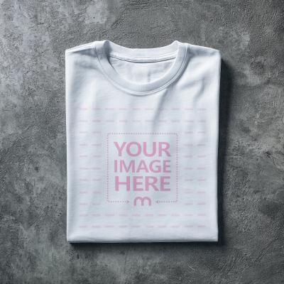 Folded Shirt Mockup Top View on Concrete Floor