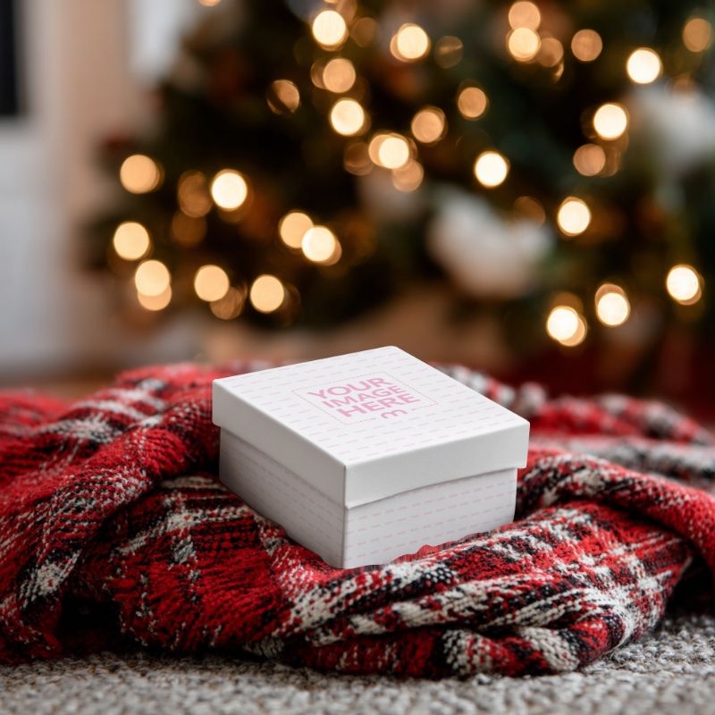Gift Box Mockup on Red Blanket with Christmas Décor for Branding preview image