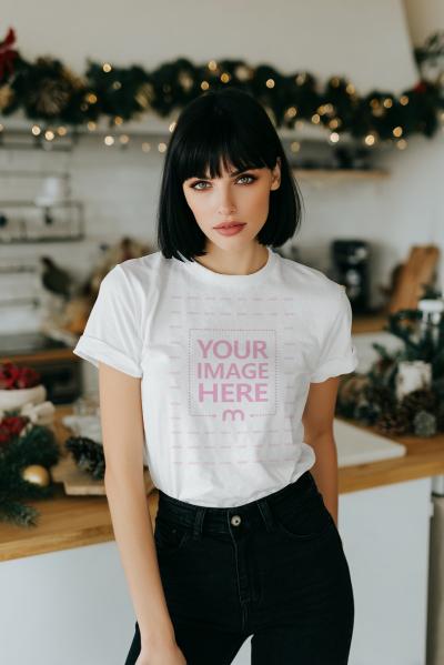T-Shirt Mockup on Woman Posing Indoor Christmas Décor Room
