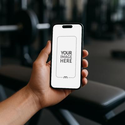 iPhone Mockup Generator in Hand with Gym Equipment in the Background