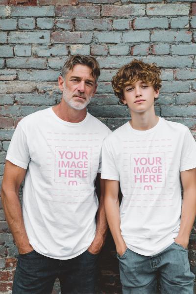 T-Shirt Mockup with Grandfather and Teen Boy Against Cyan Brick Wall