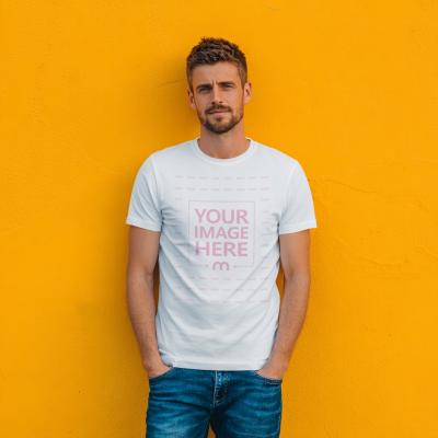 T-Shirt Mockup with Man in Front of Bright Yellow Wall Background