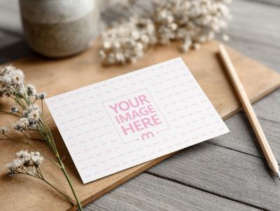 Table Name Tag Mockup Side View on Wooden Floor with Soft Arrangement