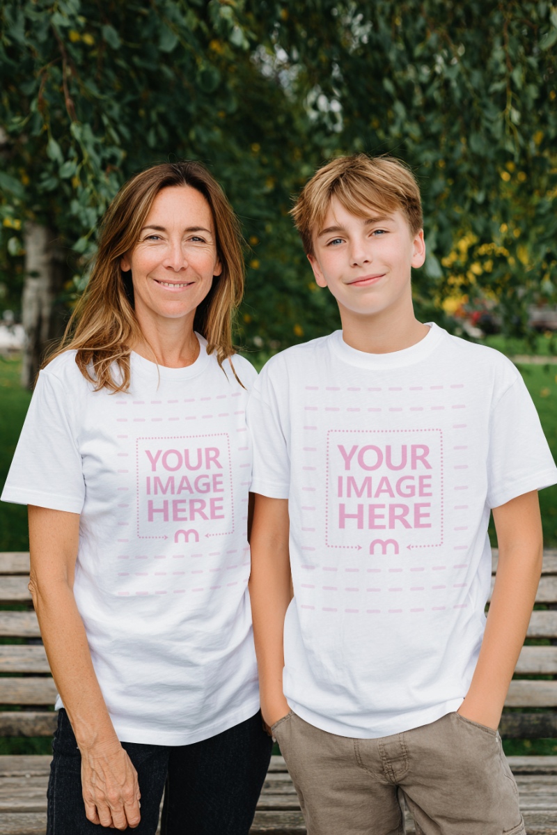 Mother and Son T-Shirt Mockup in Green Park with Casual Outdoor Vibe preview image