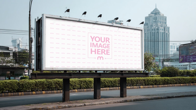 Roadside Billboard Mockup in Park Setting with Urban City Background preview image
