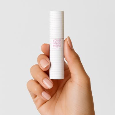 Lipstick Tube Mockup Held by Hand on Neutral Background
