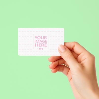 Business Card Mockup Held by Hand on Light Green Background
