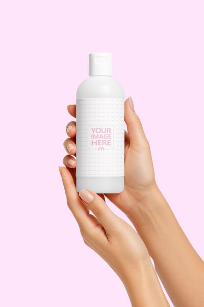 Bottle Label Mockup Held in Hand on Pink Clean Background