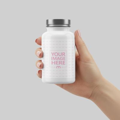 Bottle Mockup in Hand on Gray Background