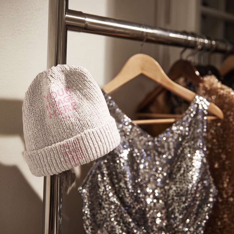 Beanie Mockup with Warm Orange Glow and Glitter Dresses preview image