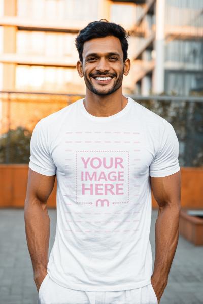 T-Shirt Mockup with Smiling Man Outdoors and City Buildings