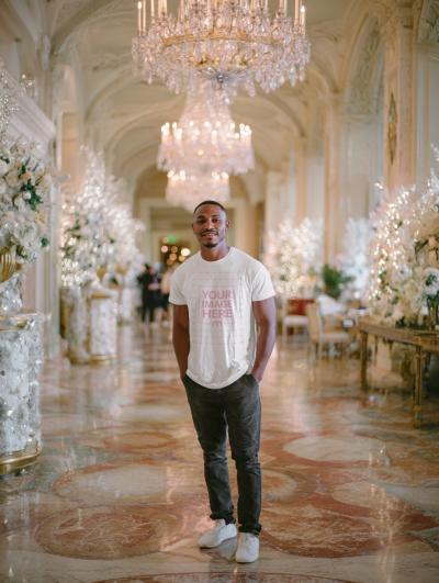 T-Shirt Mockup on Man in Modern White Interior Stylish Décor