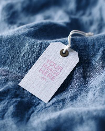Cloth Tag Mockup on Blue Jeans Fabric with Detail View