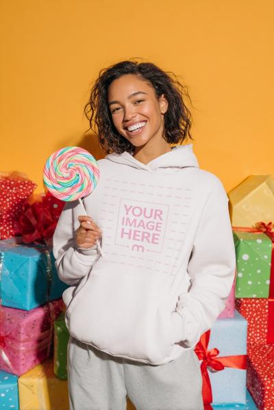 Hoodie Mockup with Woman Holding Candy