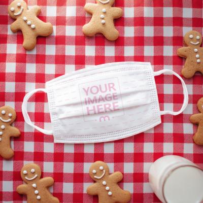 Face Mask Mockup on Red Cloth with Holiday Cookie Scene