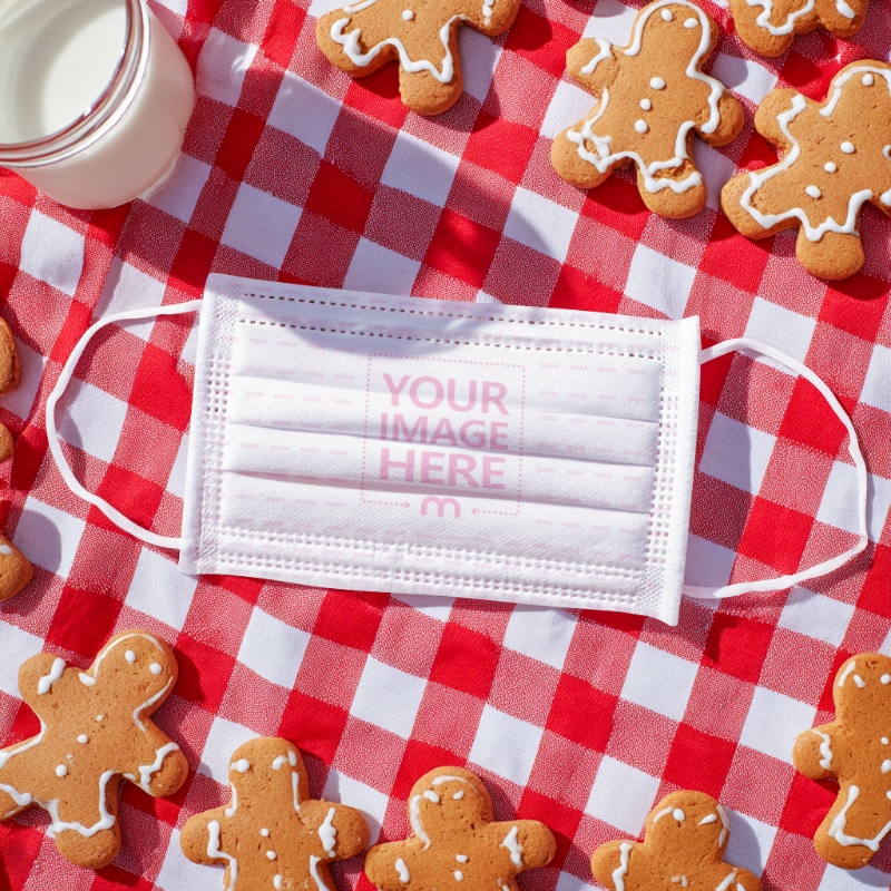 Face Mask Mockup on Red Cloth with Gingerbread Cookies preview image