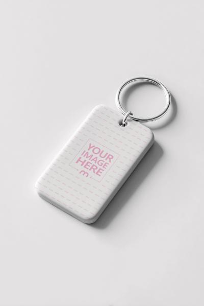 Diagonal Keychain Mockup with Metal Finish on White Scene