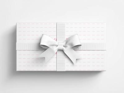 Rectangular Gift Box Mockup with Centered White Bow in Minimal Setting