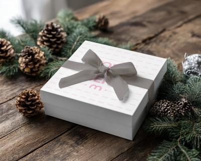 Gift Box Mockup with Linen Ribbon on Rustic Wood and Pinecones