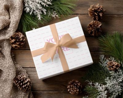 Flatlay Gift Box Mockup Surrounded by Winter Greenery