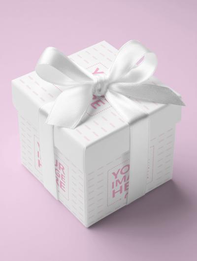 Gift Box Mockup with White Ribbon Top View on Soft Pink