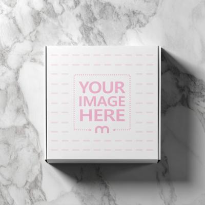Square Box Mockup Top View on Marble Surface