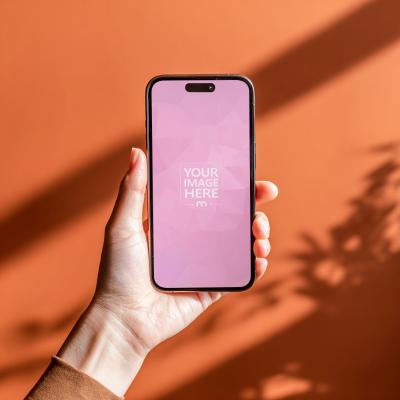 iPhone Mockup in Hand on Orange Background