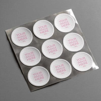 Circular Sticker Grid Mockup Arranged on Textured Sheet