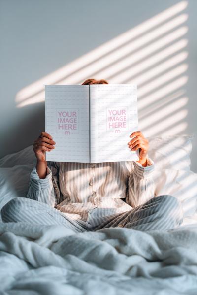Book Mockup Held by Reader in Bedroom with Soft Morning Light