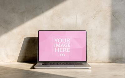 Laptop Mockup Centered on Concrete Floor with Hard Shadows