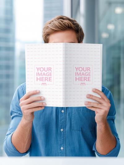 Book Mockup Held by Hand in Modern Living Room