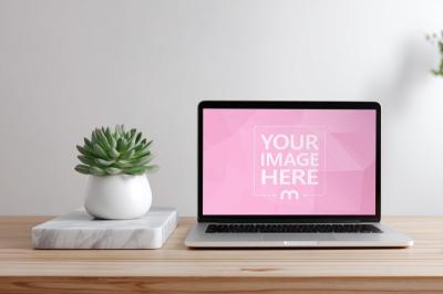 Laptop Mockup on Wooden Desk with Potted Plant