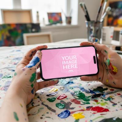 Smartphone Mockup Held by Paint-Covered Hands