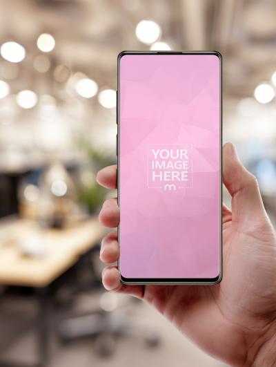 Smartphone Mockup Held in Hand in Modern Office
