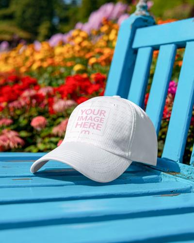 Baseball Cap Mockup on Turquoise Chair Outdoor Park