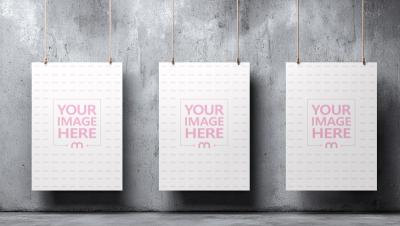 Three Vertical Poster Mockups Hanging with Rope