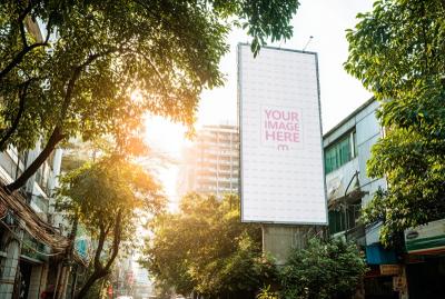 Tall City Billboard Mockup Among Trees Urban Street View