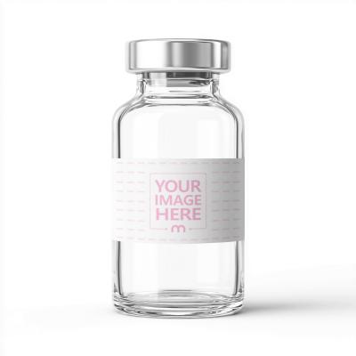 Clear Glass Vial Mockup with Metallic Cap on Surface