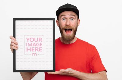 Bearded Man Holding Vertical Poster Frame Mockup