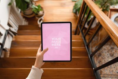 Hands Holding Tablet Mockup on Wooden Stairs