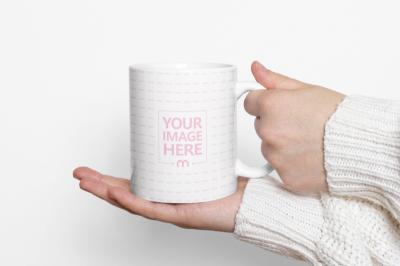 Person in Sweater Holding White Ceramic Mug Mockup