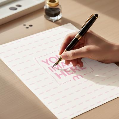Paper Mockup on Table with Hand Writing and Pen