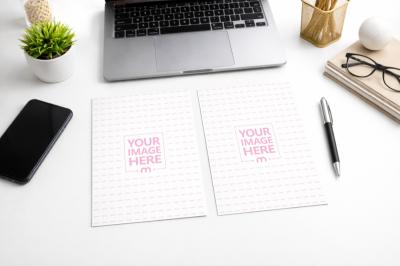 A5 Letter Paper Mockup on White Office Desk Next to Laptop
