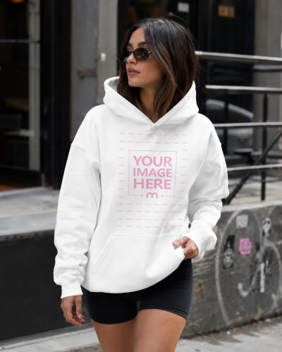 Customisable Hoodie Mockup with Woman in Urban Street Scene